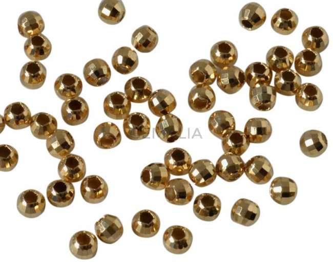 Bola latón. Facetada. 4mm. Dorado. Int.1,8mm.