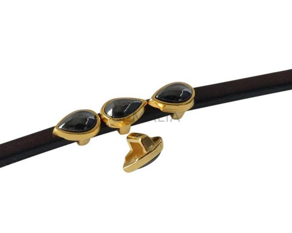 Entrepieza de SWAROVSKI gota 8x5mm. Dorado-Jet hematite. Int.3x2mm