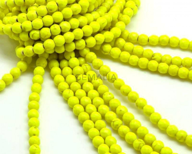 Turquesa pintada.Bola.6mm.Facetada.Amarillo fluor.Int.1,5mm aprox.