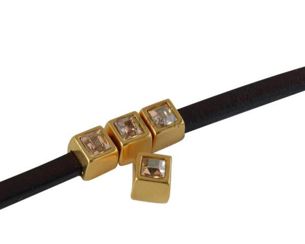 Entrepieza de SWAROVSKI cuadrado 5x5mm. Dorado-Golden Shadow. Int.3x2mm