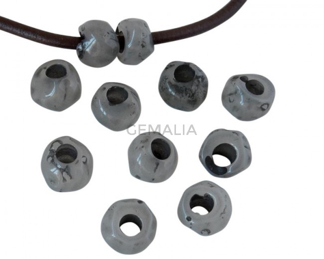 Resin irregular rondell 9x9x7mm. Opaque grey. Inn.3mm aprox. Best Quality.