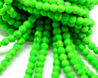 Turquoise. Dyed. Round. 6mm. Fluoresent green. Inn.1mm.approx.