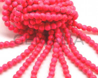 Turquoise. Dyed. Round. 6mm.  Fluorescent fuchsia2.Inn.1mm.approx.