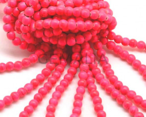 Turquoise. Dyed. Round. 6mm.  Fluorescent fuchsia2.Inn.1mm.approx.
