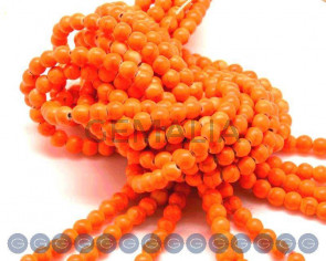 Turquoise. Dyed. Round. 6mm. Fluorescent orange2. Inn.1mm.approx.